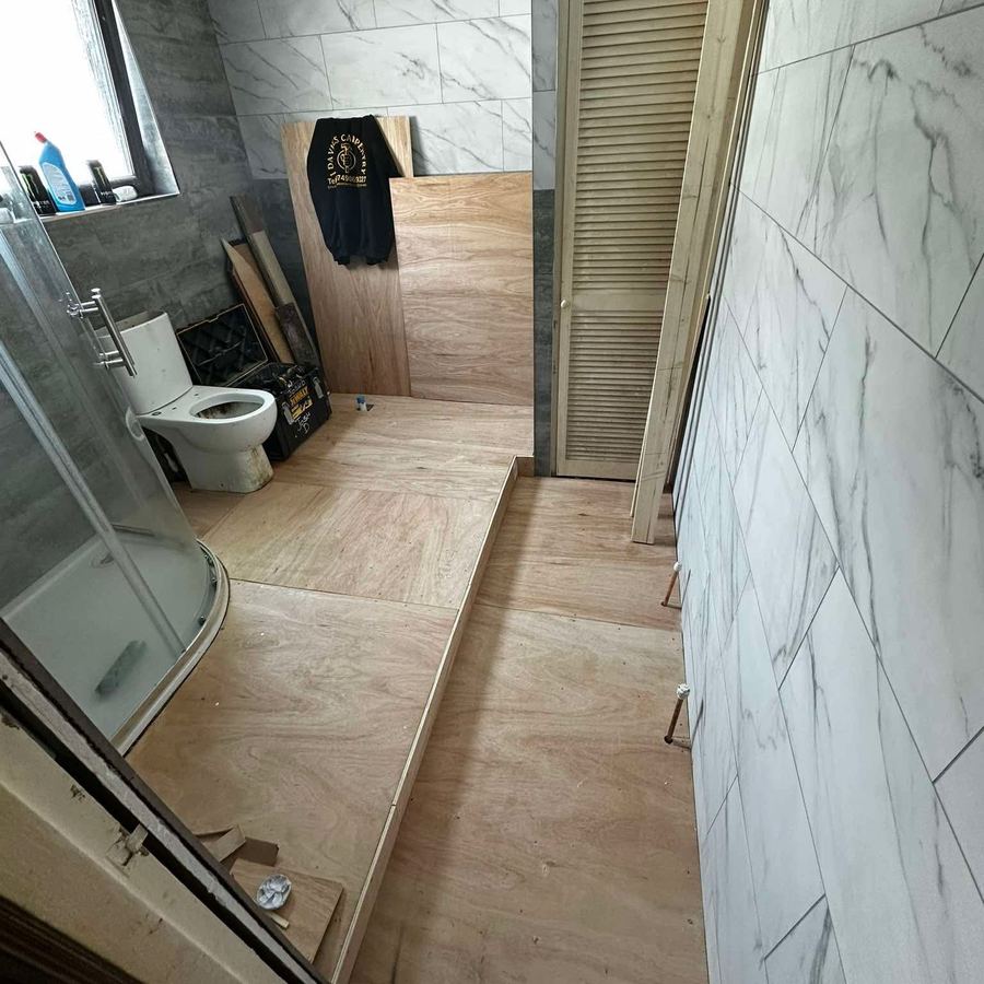 Bathroom renovation with marble-effect wall panels