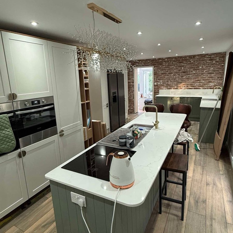 Kitchen island with quartz top and built-in ovens
