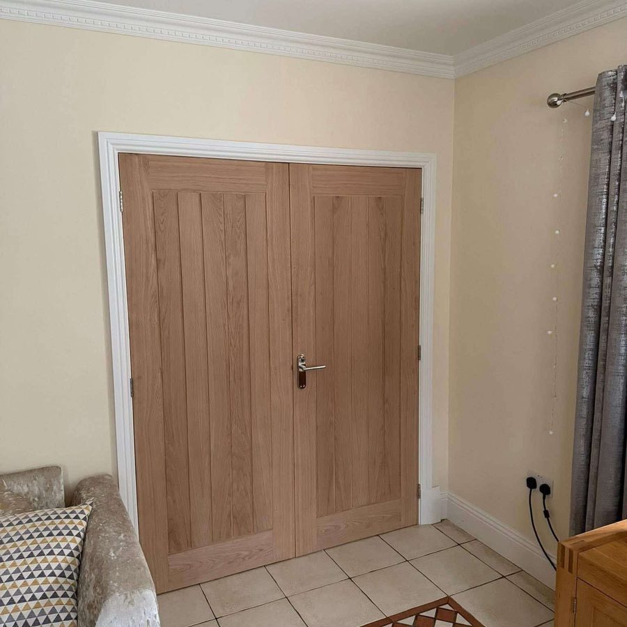 Oak double doors fitted in a hallway