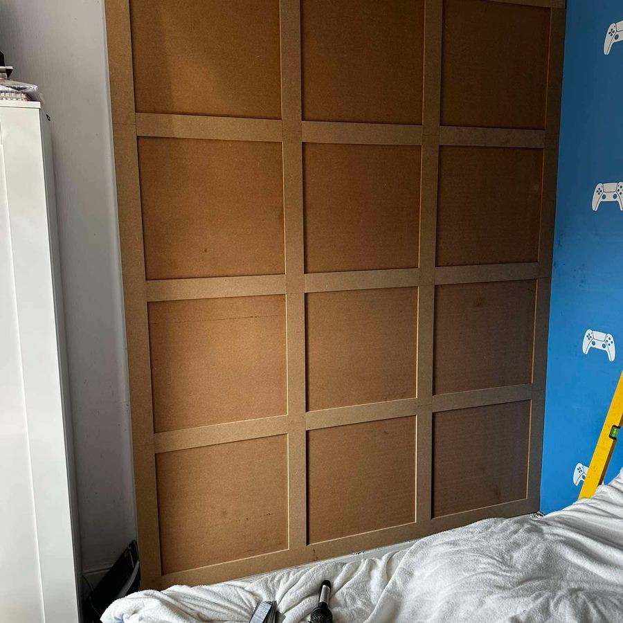 Bedroom wall with timber panelling
